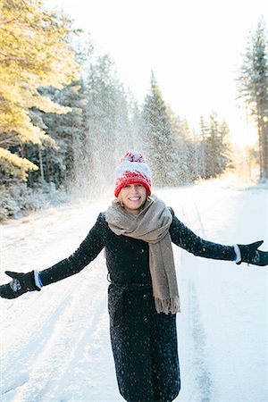 simsearch:6102-08168884,k - Smiling woman at winter Stock Photo - Premium Royalty-Free, Code: 6102-08384493