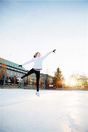 people outdoors winter activity - Woman figure skating Stock Photo - Premium Royalty-Free, Code: 6102-08388098