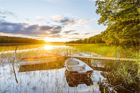 Rowboats at sunset Foto de stock - Sin royalties Premium, Código: 6102-08388027