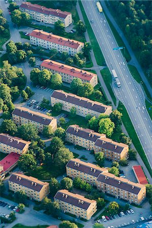 simsearch:6102-08520618,k - Aerial vie of houses near road Stock Photo - Premium Royalty-Free, Code: 6102-08388123