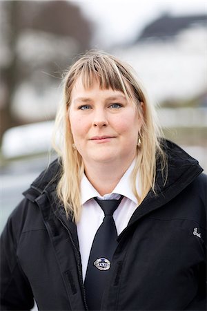 Portrait of female taxi driver Stock Photo - Premium Royalty-Free, Code: 6102-08388253