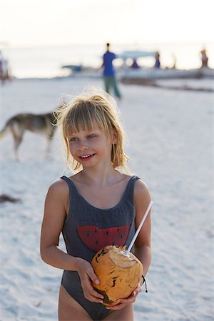 simsearch:6102-08996069,k - Girl with coconut drink on beach Stock Photo - Premium Royalty-Free, Code: 6102-08388291