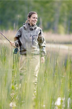 Woman fishing - Stock Photo - Masterfile - Premium Royalty-Free, Code:  6102-08168867