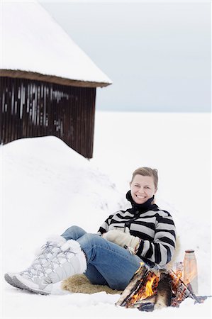 fire in winter - Woman having campfire at winter Stock Photo - Premium Royalty-Free, Code: 6102-08329799