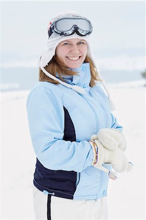 ski goggles mature not senior - Smiling woman looking at camera Stock Photo - Premium Royalty-Free, Code: 6102-08329833