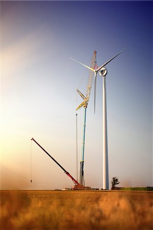 simsearch:6102-03749224,k - Crane installing wind turbine Stock Photo - Premium Royalty-Free, Code: 6102-08481090