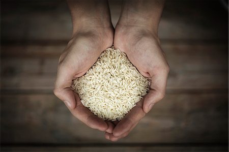 simsearch:6102-07843927,k - Rice in mans hands, close-up Stock Photo - Premium Royalty-Free, Code: 6102-08481136