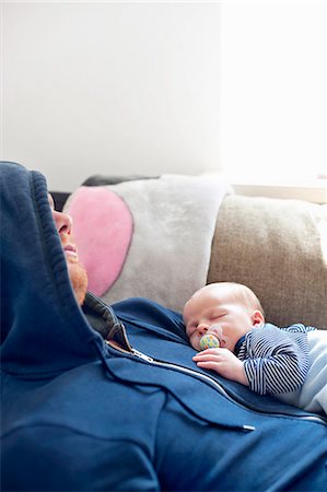 simsearch:6102-08001127,k - Father sleeping on sofa with baby son Stock Photo - Premium Royalty-Free, Code: 6102-08542061