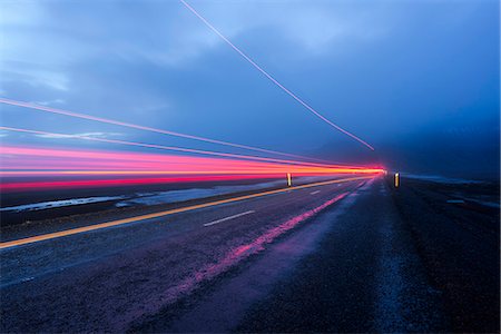 Light trail on road at dusk Stock Photo - Premium Royalty-Free, Code: 6102-08542140