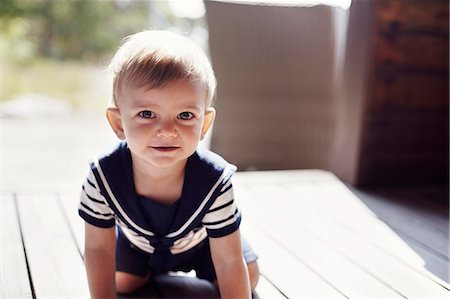 porch person - Portrait of baby boy on porch Stock Photo - Premium Royalty-Free, Code: 6102-08542117