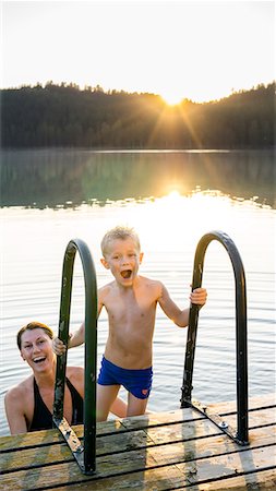 Mother and son swimming in a lake Stock Photo - Premium Royalty-Free, Code: 6102-08542250
