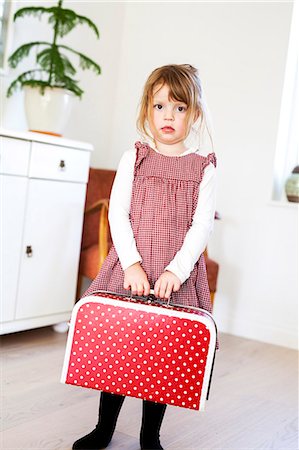 suitcase travel - Girl with a dotted suitcase Stock Photo - Premium Royalty-Free, Code: 6102-08542286