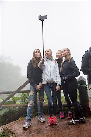 Group of teenage girls taking selfie Stock Photo - Premium Royalty-Free, Code: 6102-08542372