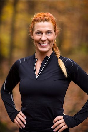 Portrait of young woman in forest Stock Photo - Premium Royalty-Free, Code: 6102-08542399