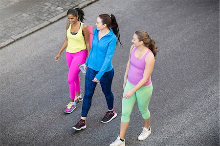 Female joggers talking on road Stock Photo - Premium Royalty-Free, Code: 6102-08542422