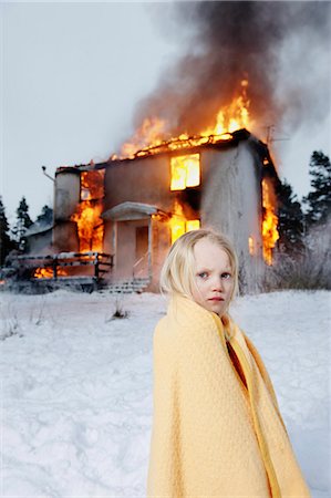 sad winter - Rescued girl in front of burning house Stock Photo - Premium Royalty-Free, Code: 6102-08558960
