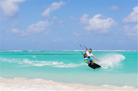 simsearch:640-03257107,k - Mid adult man kite surfing Stock Photo - Premium Royalty-Free, Code: 6102-08559050