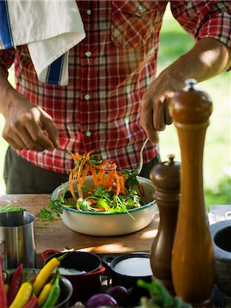 simsearch:6102-08800567,k - Man cooking outdoors, Sweden. Stock Photo - Premium Royalty-Free, Code: 6102-08559521