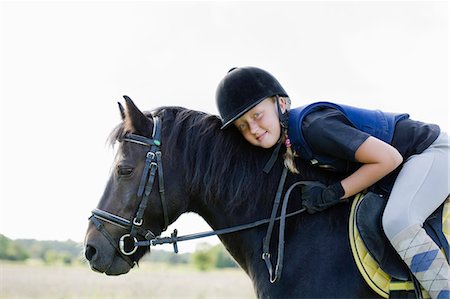 simsearch:6102-08746672,k - England, Cornwall, Dartmoor, portrait of girl (10-11) riding horse Photographie de stock - Premium Libres de Droits, Code: 6102-08566083