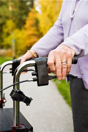 simsearch:6102-08566169,k - Senior woman holding pushchair, close-up, mid section Stock Photo - Premium Royalty-Free, Code: 6102-08566169