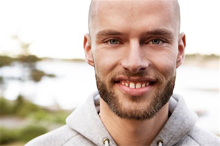 simsearch:6102-03905685,k - Portrait of young man in hooded shirt Stock Photo - Premium Royalty-Free, Code: 6102-08566124