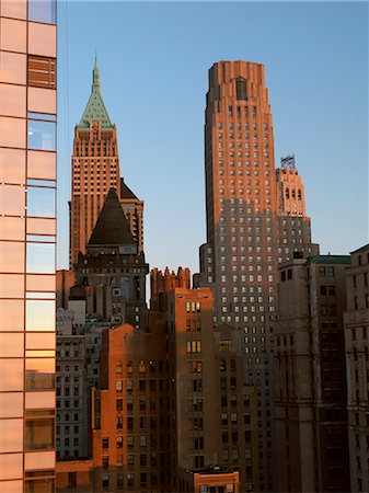 simsearch:6102-08566213,k - View of skyscraper in New York City at evening Foto de stock - Royalty Free Premium, Número: 6102-08566282
