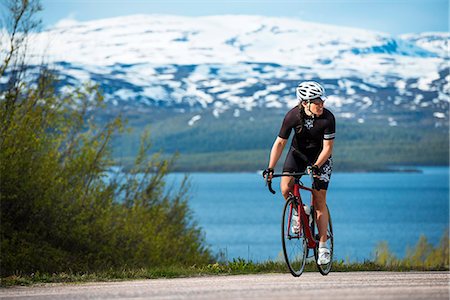 Woman cycling Stock Photo - Premium Royalty-Free, Code: 6102-08566392