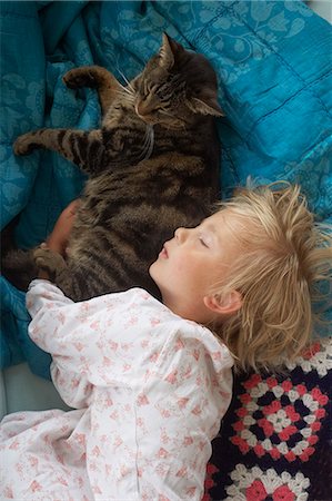 simsearch:700-00080622,k - Girl sleeping with cat Stock Photo - Premium Royalty-Free, Code: 6102-08566453