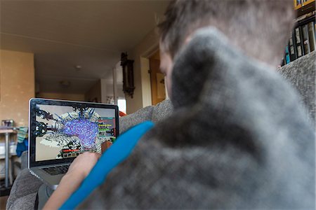 pov - Boy using laptop Stock Photo - Premium Royalty-Free, Code: 6102-08566633