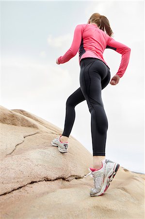 simsearch:6102-08566182,k - Woman running up a hill Stock Photo - Premium Royalty-Free, Code: 6102-08520561