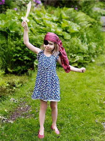 summer newest images - Portrait of girl swinging sword Stock Photo - Premium Royalty-Free, Code: 6102-08520670