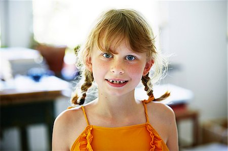 freckled kid - Portrait of girl with pigtails Stock Photo - Premium Royalty-Free, Code: 6102-08520700