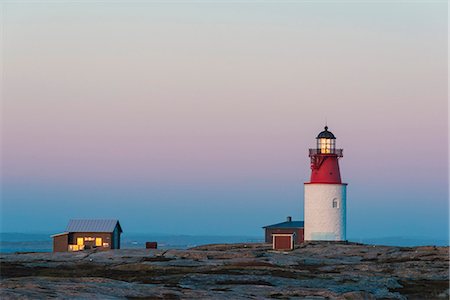 simsearch:6102-08000559,k - Lighthouse at sunset Stock Photo - Premium Royalty-Free, Code: 6102-08520815