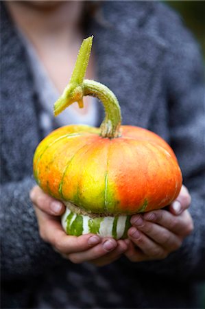 pumpkin garden - Girl holding pumpkin Stock Photo - Premium Royalty-Free, Code: 6102-08520968