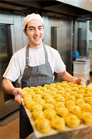 picture of a feast - Baker working in bakery Stock Photo - Premium Royalty-Free, Code: 6102-08520995