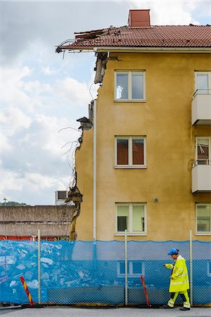 picture of old man construction worker - Man walking by demolished house Stock Photo - Premium Royalty-Free, Code: 6102-08520913