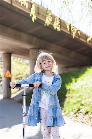 Girl on a scooter Stock Photo - Premium Royalty-Free, Code: 6102-08642004