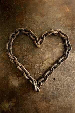 Rusty chain in heart shape Photographie de stock - Premium Libres de Droits, Code: 6102-08642131