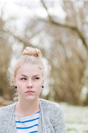 simsearch:6102-08683485,k - Portrait of young woman looking away from camera Stock Photo - Premium Royalty-Free, Code: 6102-08683178