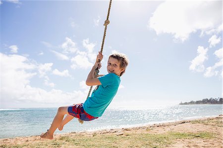 simsearch:400-05097844,k - Boy swinging on beach Stock Photo - Premium Royalty-Free, Code: 6102-08683262