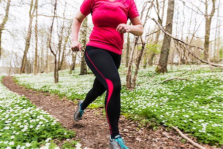 simsearch:6102-08994936,k - Woman running in spring forest Photographie de stock - Premium Libres de Droits, Code: 6102-08683496