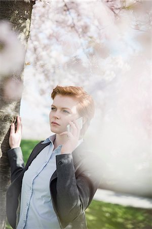 simsearch:6102-08942535,k - Young woman talking via cell phone Stock Photo - Premium Royalty-Free, Code: 6102-08683522