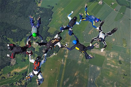 simsearch:649-07238951,k - Skydivers in formation mid-air Stock Photo - Premium Royalty-Free, Code: 6102-08746270