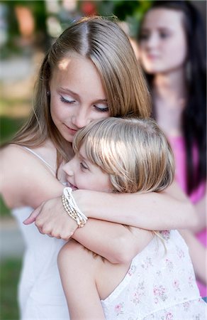 Two sisters embracing Stock Photo - Premium Royalty-Free, Code: 6102-08746223
