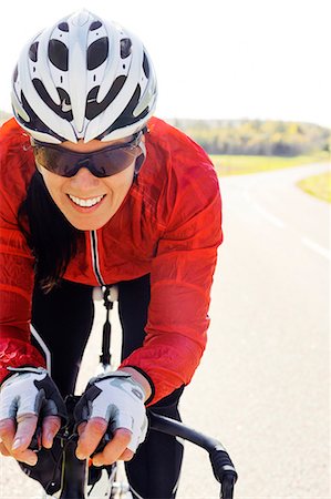 female triathlon - Woman riding bike Stock Photo - Premium Royalty-Free, Code: 6102-08746332