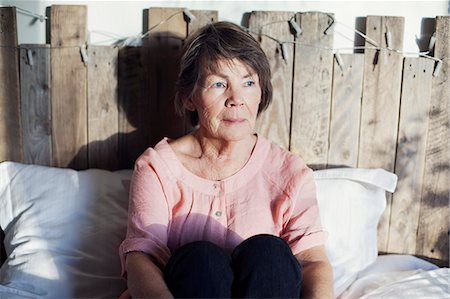 forlorn older woman - Senior woman sitting in bed Stock Photo - Premium Royalty-Free, Code: 6102-08746473