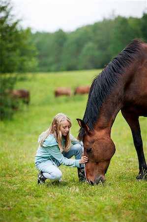 simsearch:6102-08746672,k - Girl with horse on meadow Photographie de stock - Premium Libres de Droits, Code: 6102-08746674