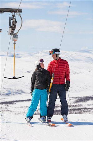 simsearch:6102-08746879,k - Father and daughter on ski drag Photographie de stock - Premium Libres de Droits, Code: 6102-08746772