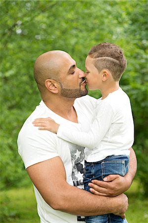 Father with son kissing Stock Photo - Premium Royalty-Free, Code: 6102-08746723