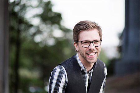 simsearch:6102-08746896,k - Portrait of young smiling man Photographie de stock - Premium Libres de Droits, Code: 6102-08746887